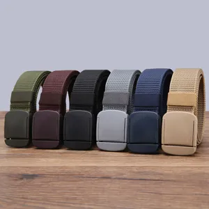 Close-up detail of multi-color nylon canvas belts with plastic buckles in casual style.
