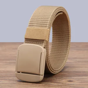 Detailed view of khaki nylon canvas belt with plastic buckle, casual minimalist design.