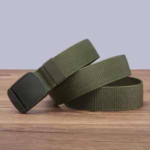 Detailed close-up shot of army green nylon canvas belt showing texture and plastic buckle.