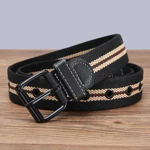 Close-up details of mens casual canvas belt with striped pattern and metal grommets