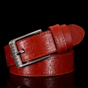 Men red faux leather belt with metal pin buckle and embossed portrait design casual wear.