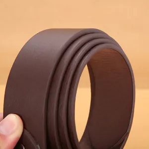Close-up detailed view of the dark brown PU leather belt showing texture and smooth edge.