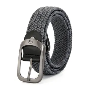 Detailed view of grey woven elastic belt with durable metal buckle and stylish leather tip.