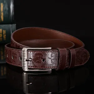Men's brown leather belt with pin buckle and embossed portrait design for casual wear.