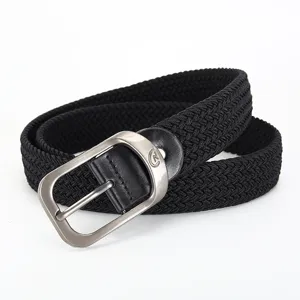 Detailed view of the black woven elastic belt with metal buckle, casual stretch style.