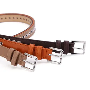 Women thin leather belt with metal buckle and eyelets, stylish casual accessory for dresses.