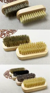 Detailed view of wooden shoe brushes with soft bristles for delicate cleaning and dusting.