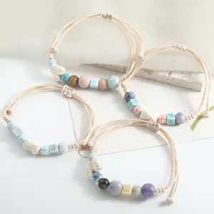 Handmade ceramic bead braided bracelets detail view, featuring fresh artistic style charms.