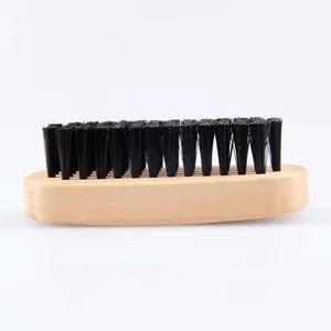 Wooden handle cleaning brush with black bristles, perfect for shoes, clothes, and dust removal.