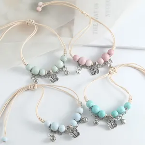 Bracelets chics en perles de céramique de Jingdezhen avec charms papillon et cordon réglable.