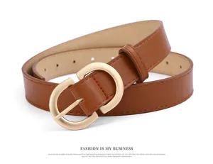 Detailed shot of women brown faux leather belt with stylish gold buckle for jeans and wear.