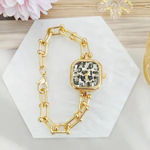 Elegant gold square watch with leopard print dial and stylish chain bracelet for women.