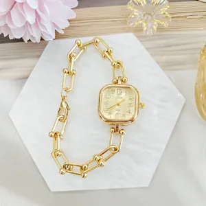 Luxury gold square women quartz watch with stylish chain link bracelet for daily elegant wear.