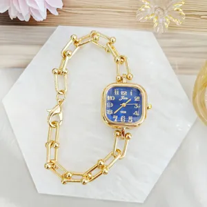 Elegant square women watch with stylish chain strap and blue dial, detailed view features.