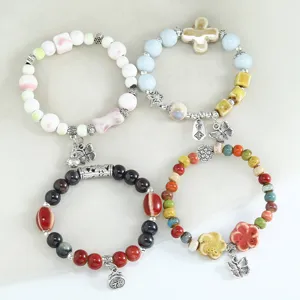 Nuovo set di bracciali di perle in ceramica stile cinese, gioielli elastici fatti a mano.