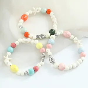 Colorful ceramic beaded bracelets set with cute fish and starfish charms for women style.