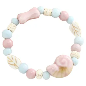Sweet ceramic beaded bracelet with shell and leaf charms, cute pastel women jewelry main view