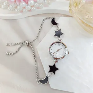 Women's star moon quartz watch with adjustable sliding chain bracelet and mother of pearl dial.