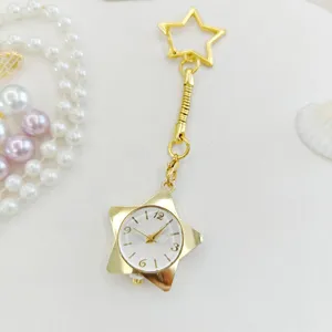 Gold star keychain watch detail, elegant women nurse watch with quartz movement charm.