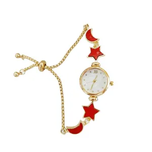 Golden star moon charm bracelet watch with white dial, elegant fashion accessory for women.