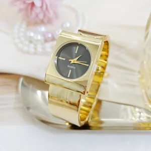Chic gold square bangle watch for women, elegant quartz wristwatch with stylish wide strap.