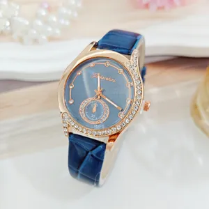 Elegante Damen Armbanduhr mit blauem Lederarmband und rosévergoldeter Strasslünette Mode.