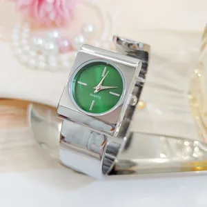 Minimalist square bangle women watch with green dial, elegant fashion quartz timepiece.