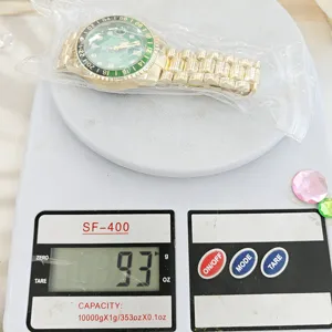 Luxury mens gold quartz watch with green dial and steel bracelet, elegant casual timepiece.