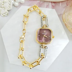 Detailed close-up of a luxury square dial quartz watch with stylish chain link strap.