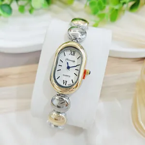 Vintage Mode Damen Quarzuhr Luxus Nische Ovales Zifferblatt Römische Ziffern Perlenarmband Legierung Weibliche Armbanduhr Schmuck