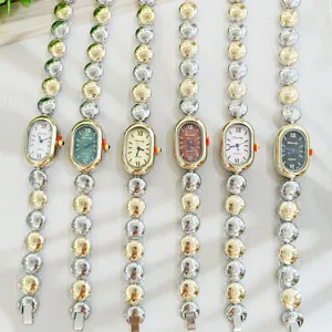 Damen Quarzarmbanduhr mit Perlen Metallarmband, elegante vintage ovale Zifferblatt Uhr.