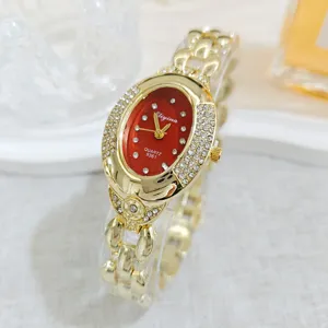 Detailed close-up of Eliyina oval red dial rhinestone gold quartz ladies bracelet watch.