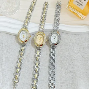 Elegant oval diamond ladies quartz watch with metal bracelet strap, vintage fashion wristwatch.