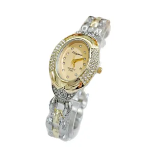 Luxury vintage oval rhinestone women quartz watch with elegant chain strap and detailed dial.