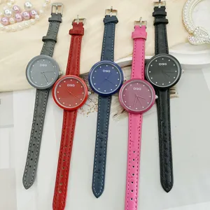 Stylish women quartz watch with leather strap, rhinestone markers and printed dial design.