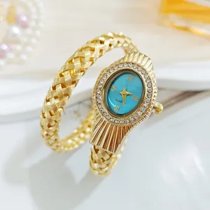 Montre quartz serpent de luxe pour femme, bracelet tressé doré avec cadran bleu et strass.