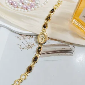 Vintage tiger eye stone quartz wristwatch for women, elegant gold bracelet fashion watch.