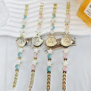 Star moon charm ladies quartz watch, elegant metal bracelet design, detail close-up.