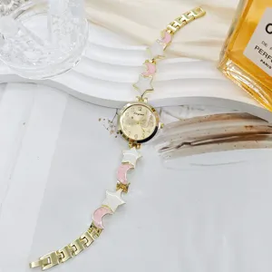 Detailed view of women's star and moon watch bracelet, showing exquisite jewelry links.