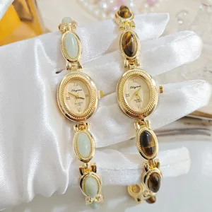 Vintage luxury oval gemstone quartz watch for women, elegant retro gold bracelet timepiece.