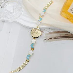 Chic celestial star moon women quartz watch with stylish gold bracelet strap elegant detail.