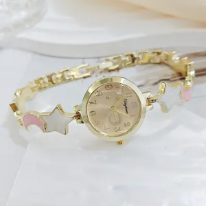 Elegant star and moon dial detail of the luxury women gold bracelet watch piece.
