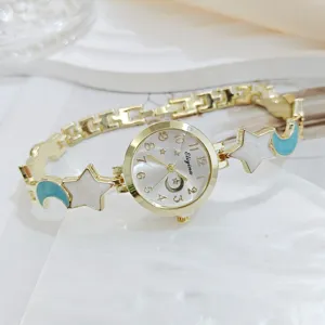 Elegant women's watch with star and moon bracelet strap, gold finish, luxury chic style.