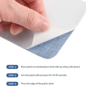 Close-up detail showing denim iron-on patch and backing paper for easy garment repair.