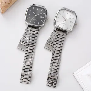 Minimalist square quartz watch with stainless steel strap, elegant couple timepiece style detail.
