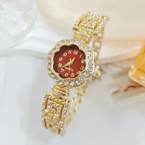 Women rhinestone quartz watch detailed view, gold tone floral dial wristwatch with sparkling crystals.