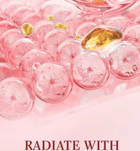 Kollagen Biotin Gesichtscreme Detailansicht mit rosa Mikroküpseln und goldenen Pflegetropfen.
