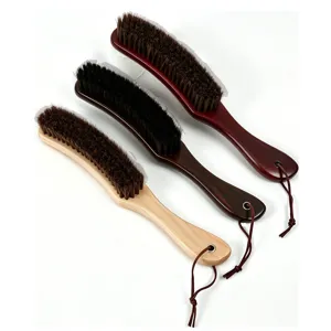 Wooden clothes brush with lanyard, horsehair suit coat dust removal and garment cleaning brush.