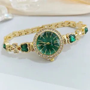 Elegant women quartz watch with green dial, diamond bezel and four-leaf clover bracelet.