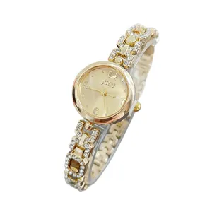 Elegant women's rhinestone quartz watch with gold metal band and sparkling crystal details.